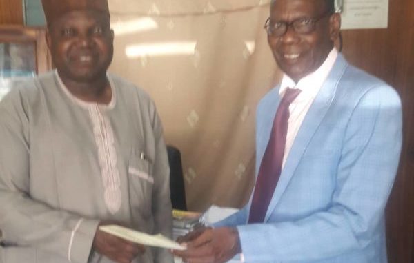 Professor Okwilagwe receiving letter